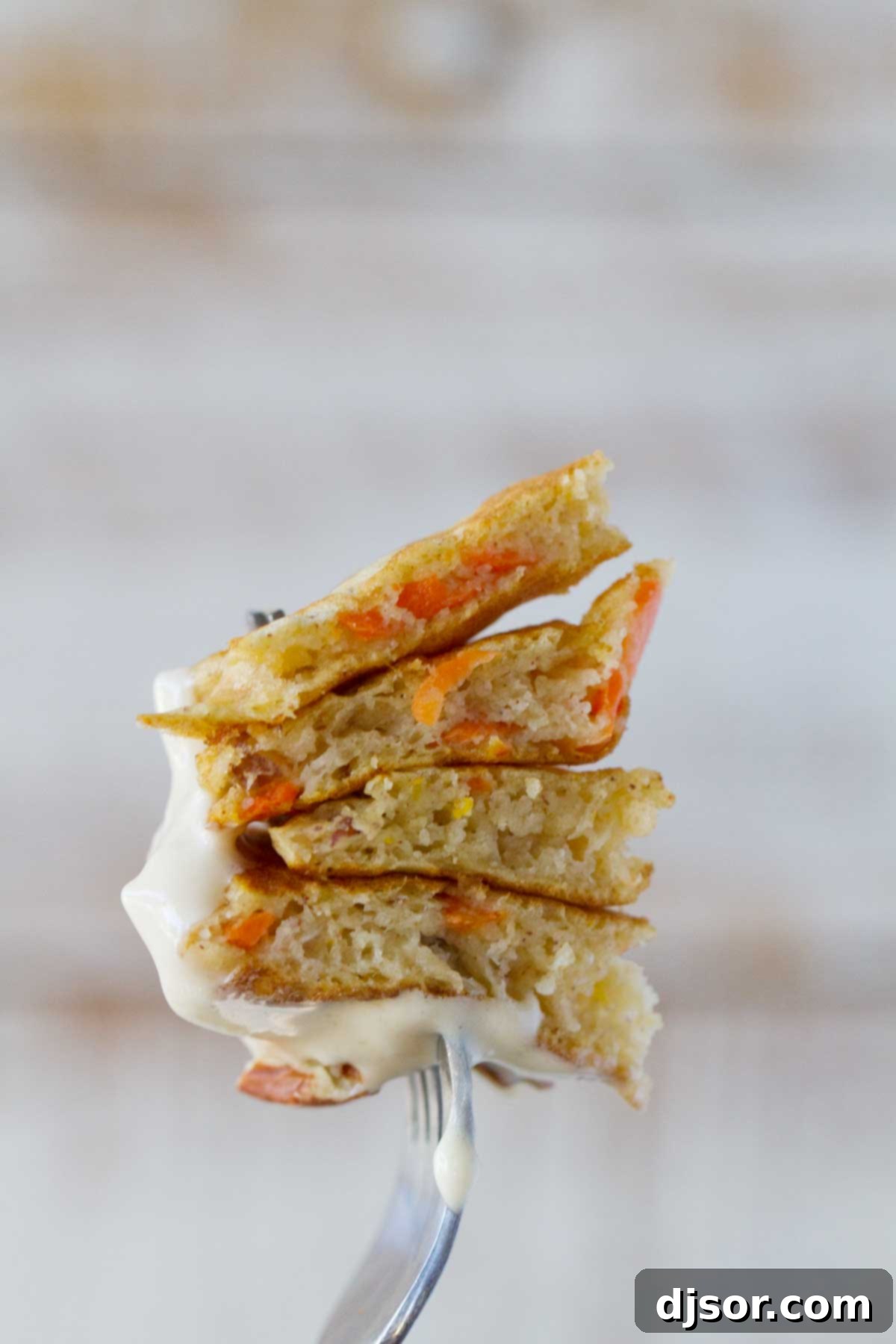 bite of carrot cake pancakes on a fork