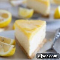 slice of lemon cheesecake with more in the background.