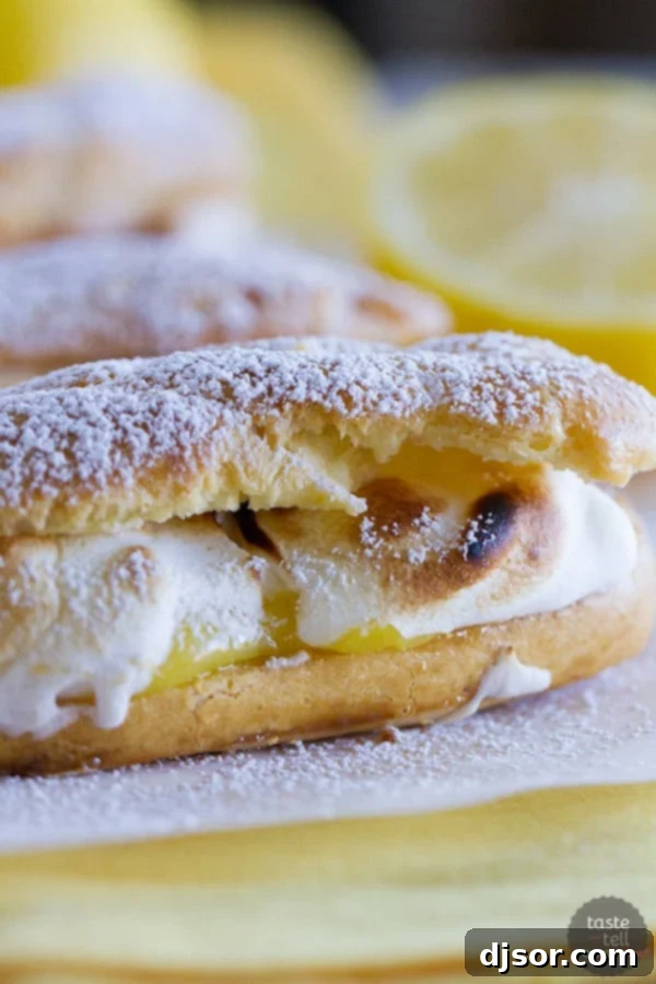 Lemon Meringue Eclairs Sweet Dreams in Every Bite 2 Delightful Lemon Meringue Eclairs featuring golden choux pastry, tangy lemon curd, and perfectly toasted meringue peaks.