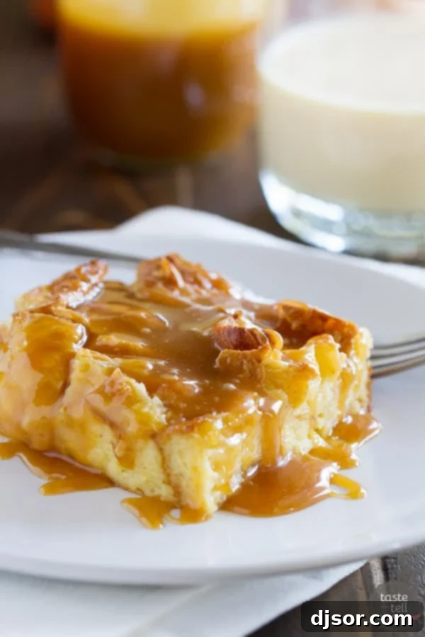 A beautifully baked Eggnog Croissant Bread Pudding, glistening with Caramel Eggnog Syrup, presented as a decadent holiday breakfast or dessert.