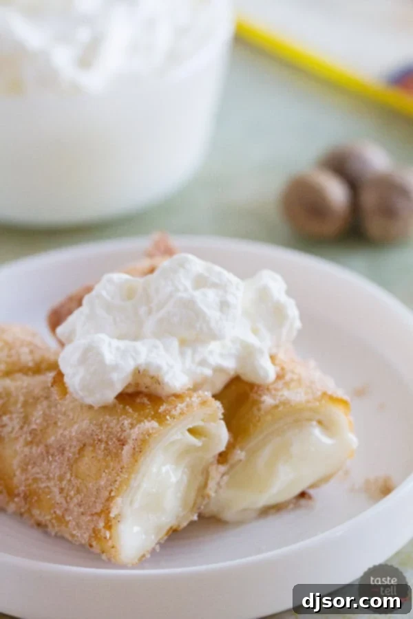 Golden brown Eggnog Empanadas dusted with cinnamon sugar, perfect for a holiday dessert.