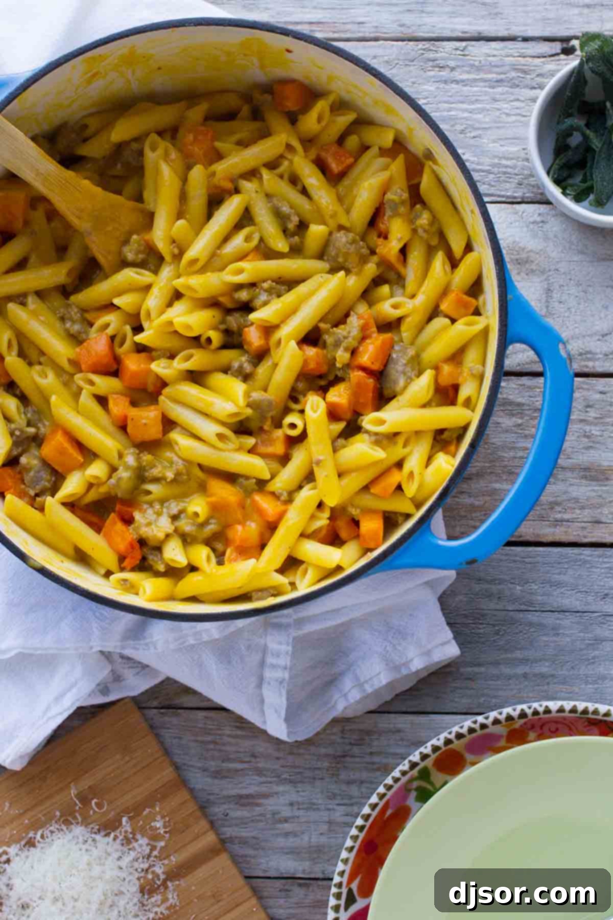 Pot filled with Penne with Butternut Squash and Sausage.
