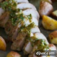 Sliced roasted pork tenderloin topped with mustard sauce and served with potatoes.