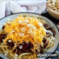 Cincinnati Chili The Five Way Wonder 10 Plate filled with Cincinnati Chili served 5 way with cheese, onions, and kidney beans.