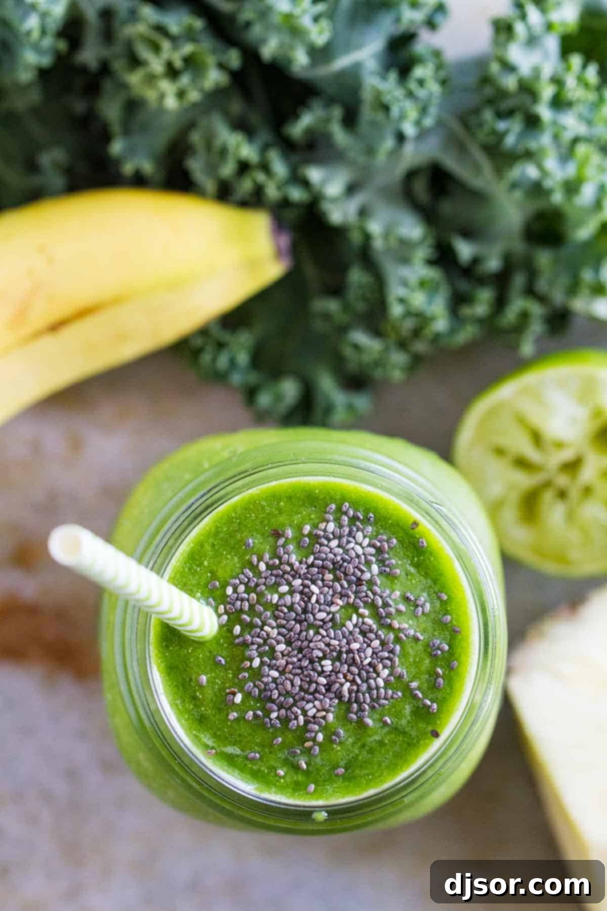 Delicious green smoothie with chia seeds. Overhead view of a vibrant green smoothie in a glass with a sprinkle of chia seeds on top, ready to be enjoyed.