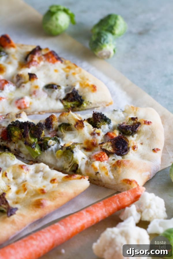 Delicious Roasted Vegetable Pizza with creamy Ranch dressing, topped with colorful, perfectly roasted vegetables.