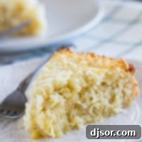 Slice of Coconut Custard Pie on a plate.