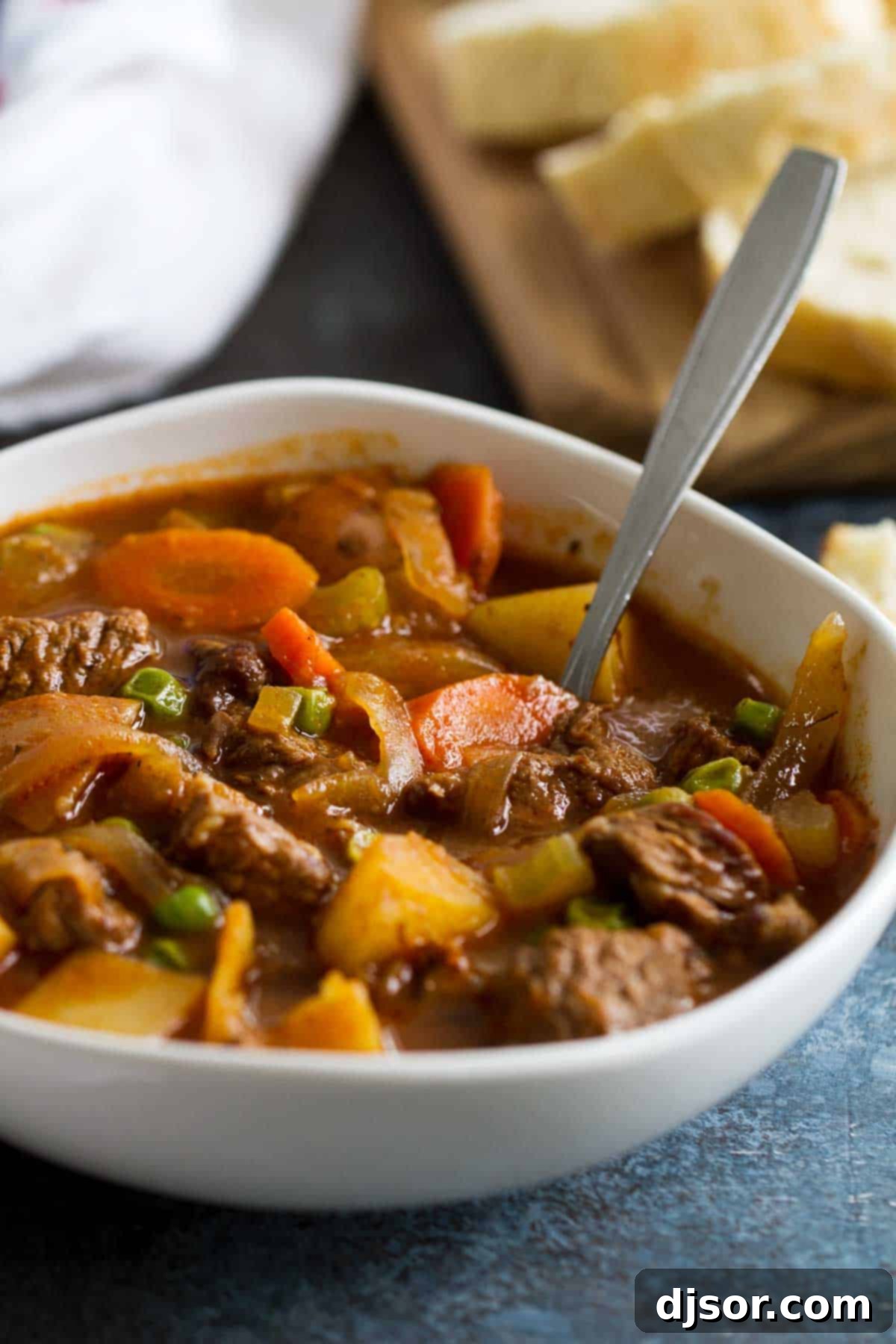 Hearty bowl of Homemade Beef Stew with crusty bread