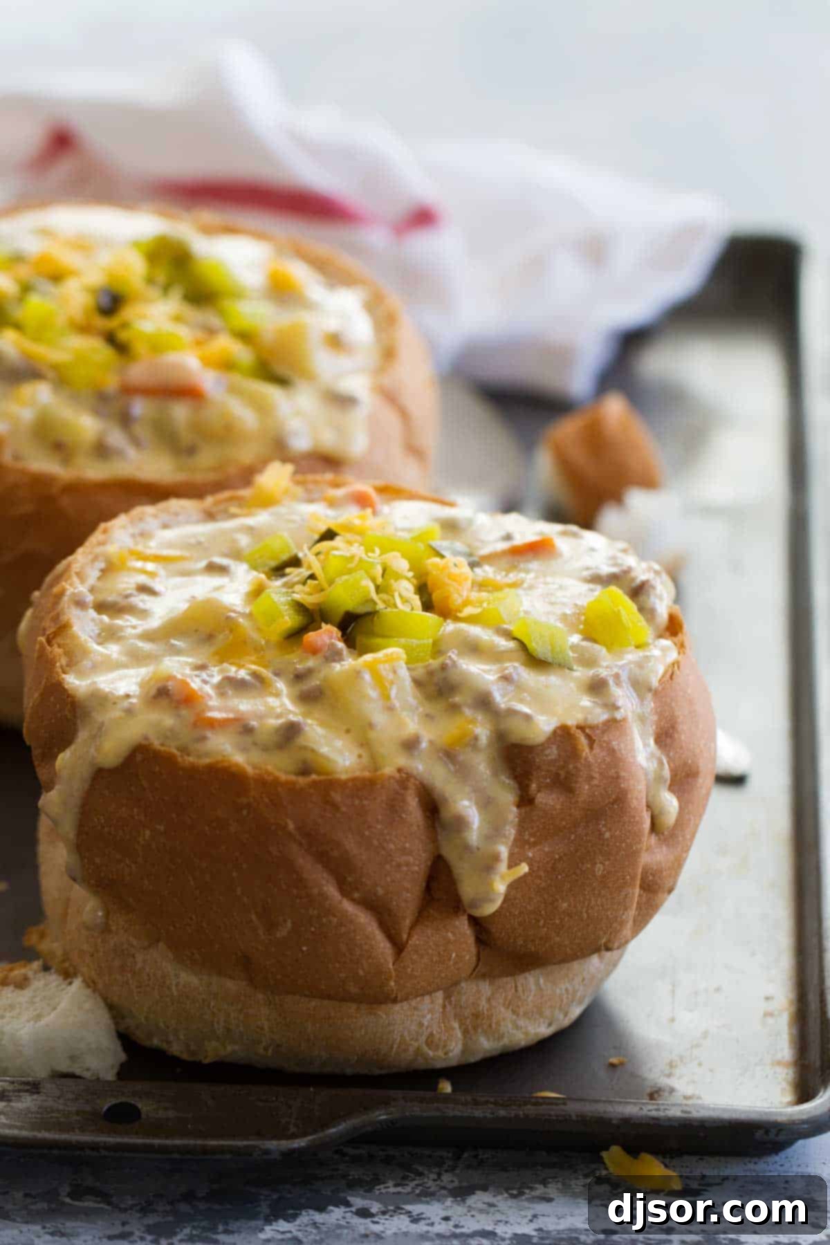 Crock Pot Cheeseburger Soup served in a crusty bread bowl