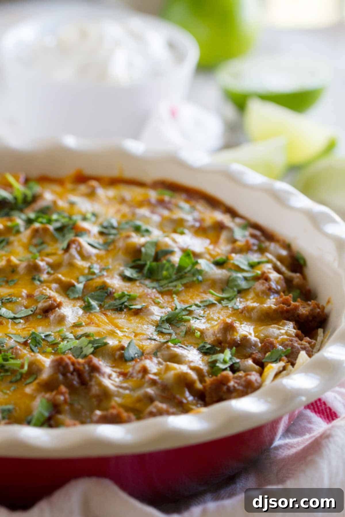 Hearty Beef Enchilada Casserole, topped with melted cheese and fresh cilantro