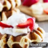 Belgian Pearl Sugar Waffles 2 Liege waffle topped with nutella, bananas, strawberries and whipped cream