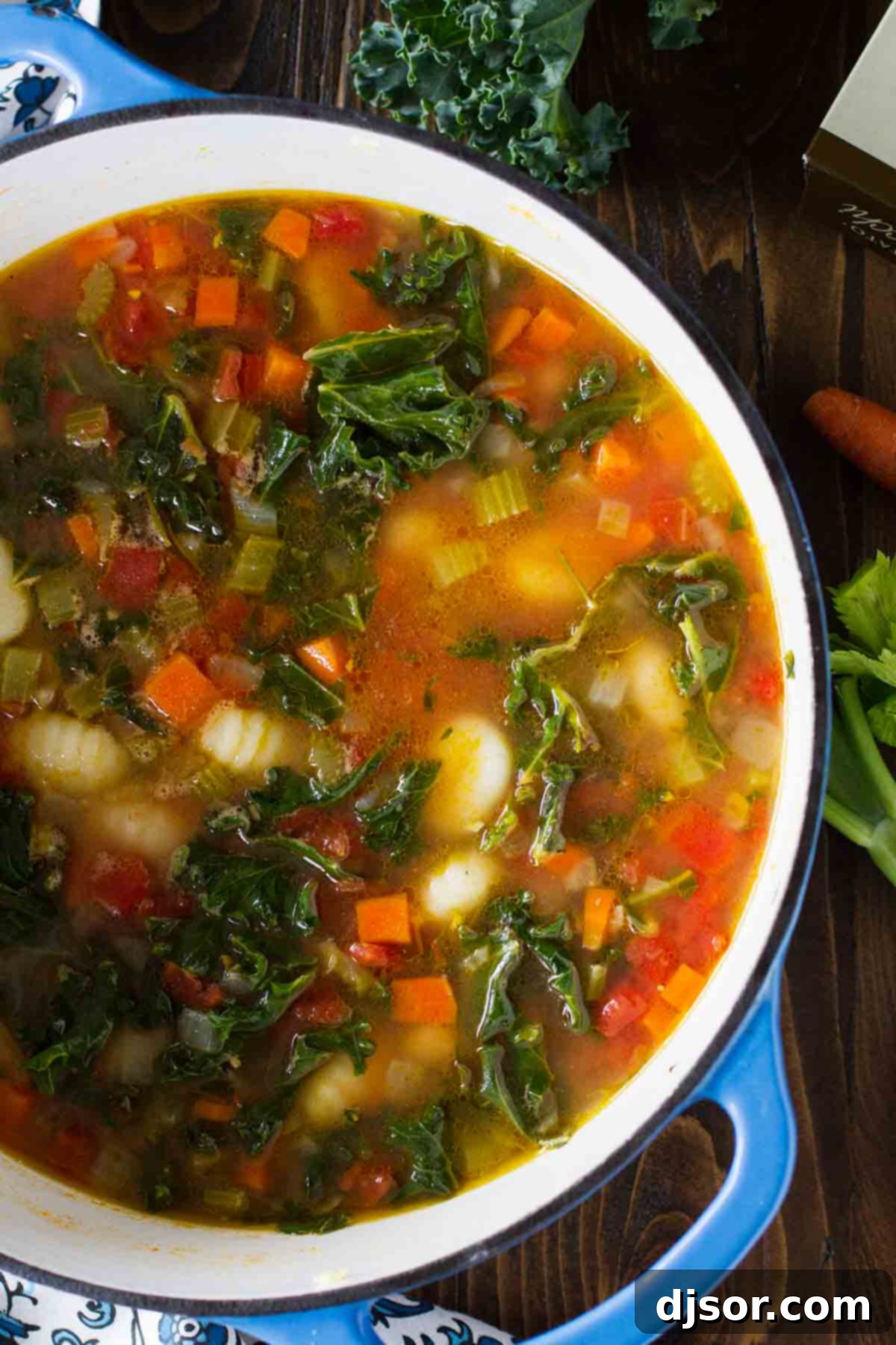 Large soup pot filled with a vibrant Minestrone with Gnocchi, ready to be served, showcasing colorful vegetables and tender gnocchi.