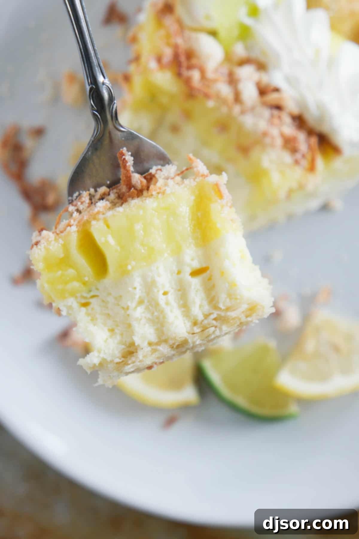 Close-up shot of a bite of Caribbean Truffle Pie on a fork, showing the distinct layers and textures.