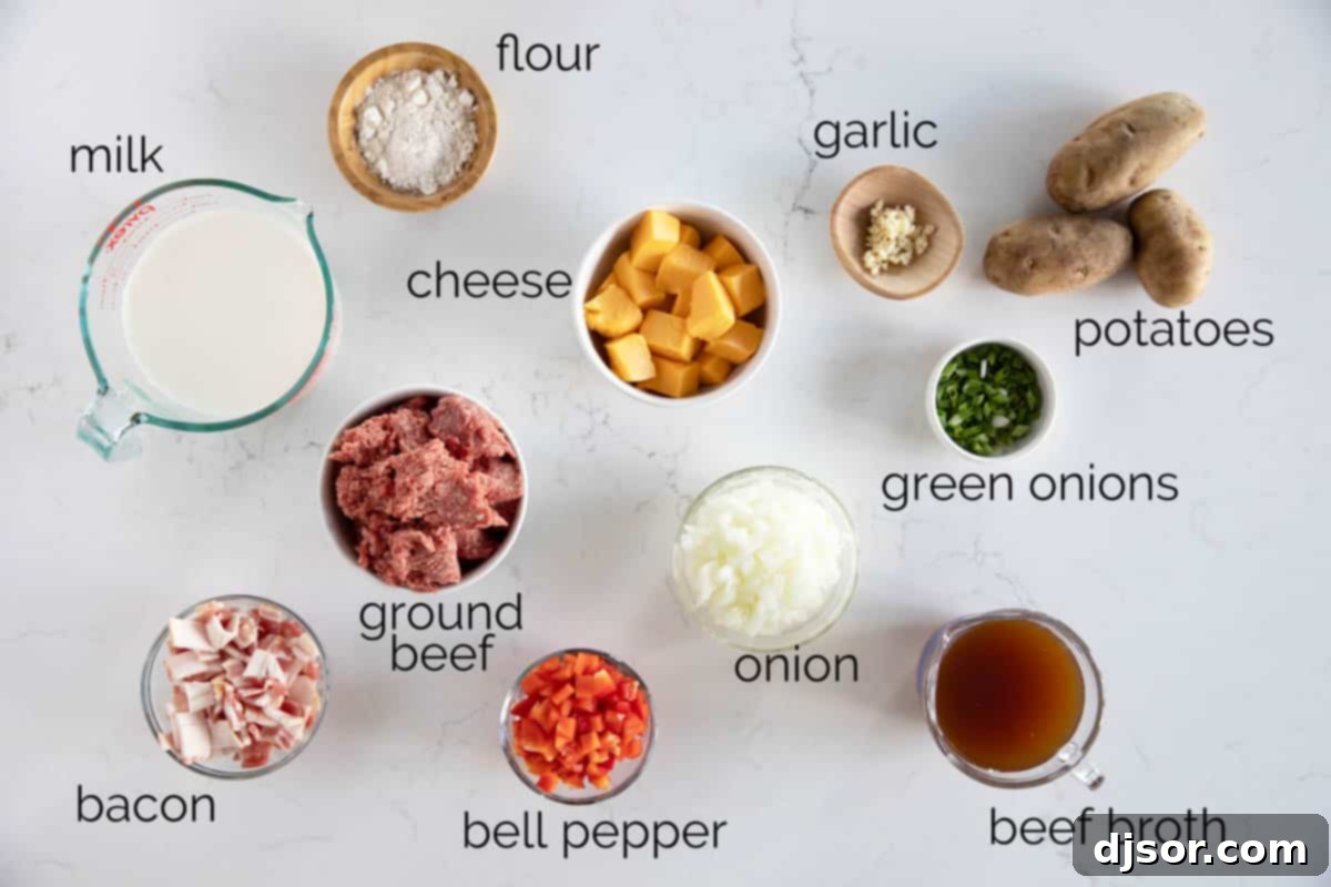 A collection of fresh ingredients laid out on a kitchen counter, including ground beef, diced onions, red bell pepper, garlic, flour, milk, beef broth, russet potatoes, strips of bacon, and a block of processed cheese, ready to be prepared for the bacon cheeseburger chowder.