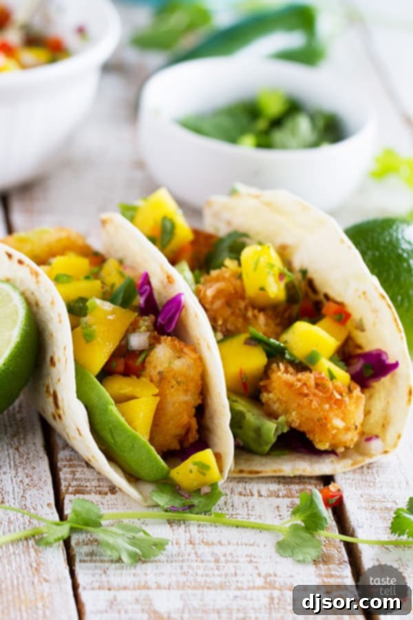 Upgrade Your Taco Night: 22 Irresistible Taco Recipes 6 Crispy coconut crusted shrimp are topped with a sweet and spicy mango salsa in this Coconut Shrimp Taco Recipe that brings a taste of the tropics to taco night!