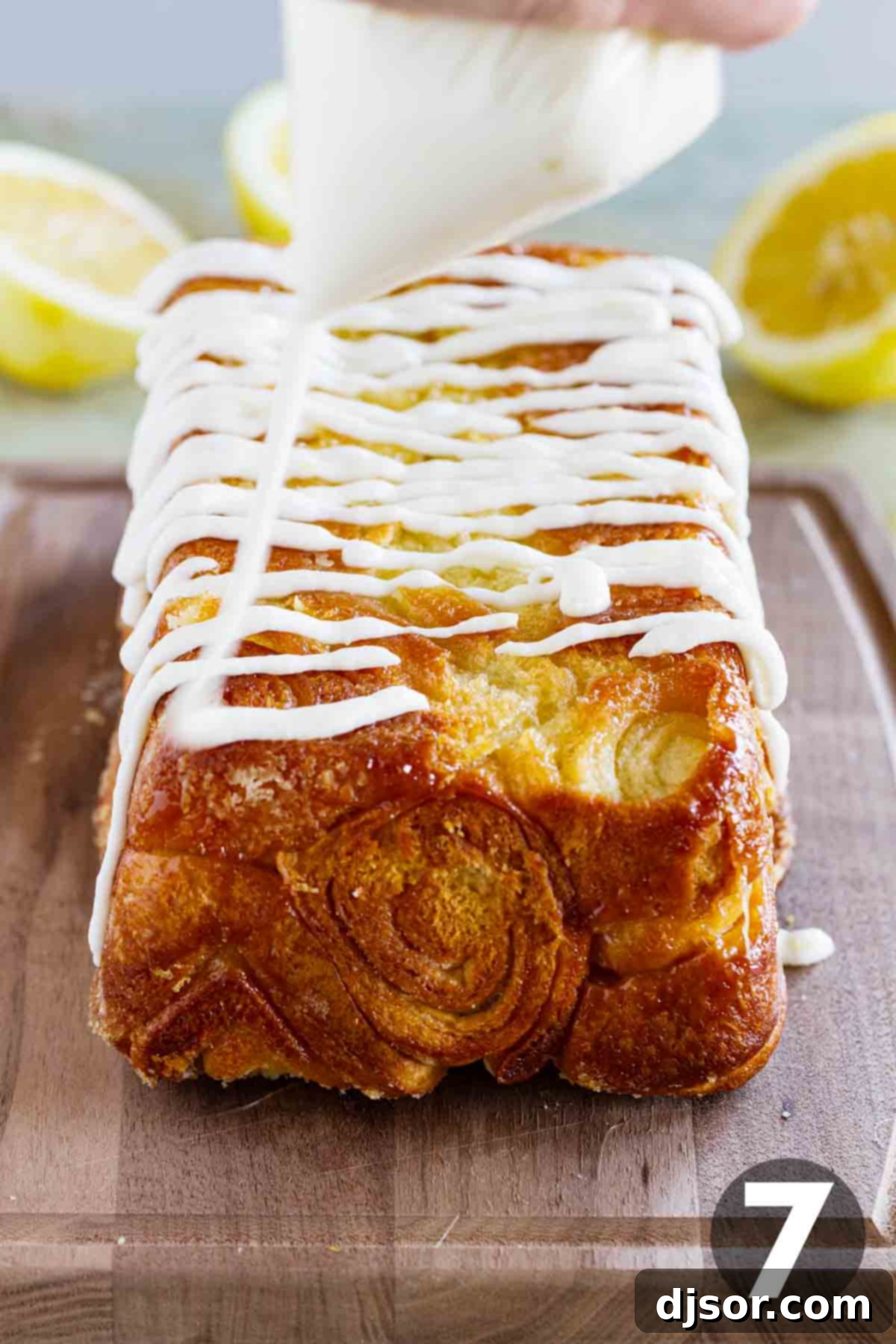 Bright Lemon Swirl Pull-Apart Loaf 6 Putting icing on a loaf of lemon roll pull apart bread.