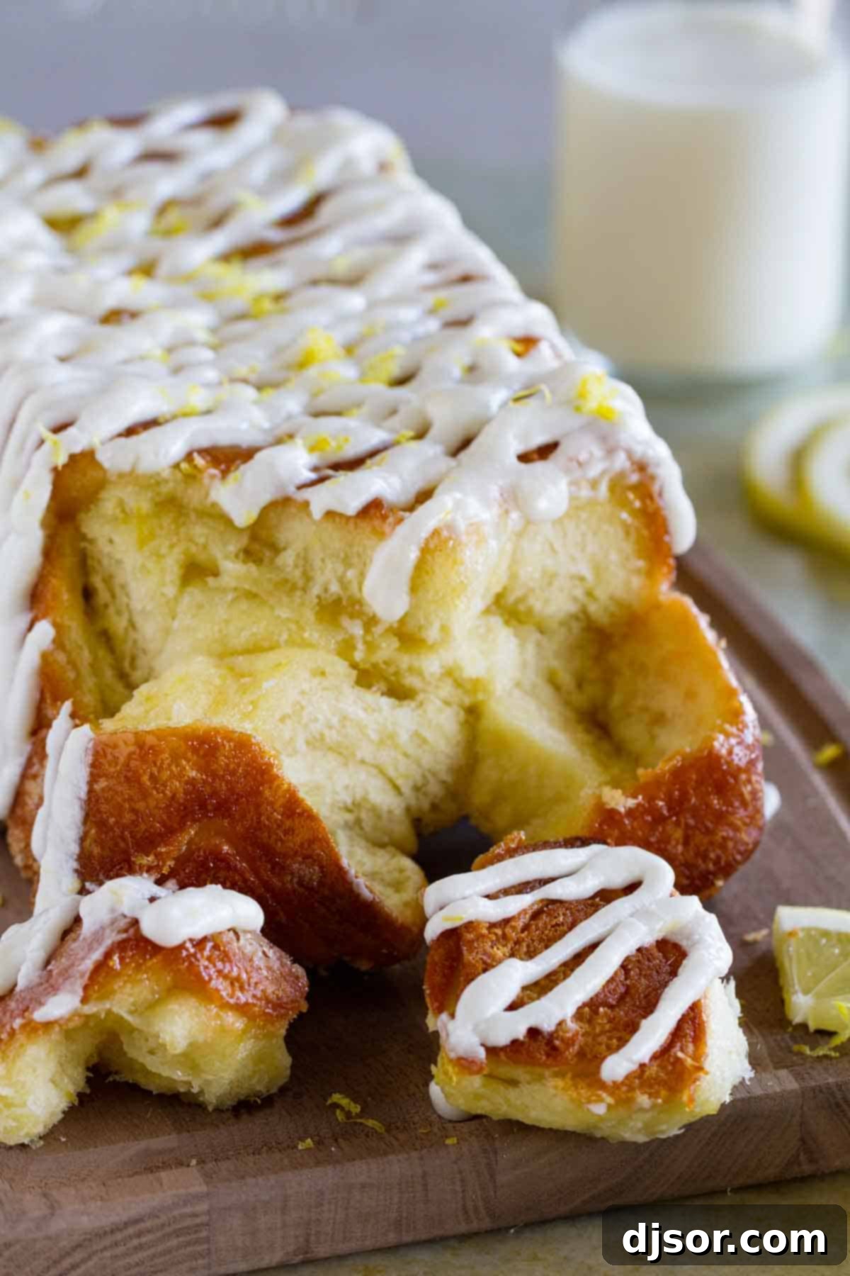 Bright Lemon Swirl Pull-Apart Loaf 8 Loaf of lemon roll pull apart bread with pieces taken off.