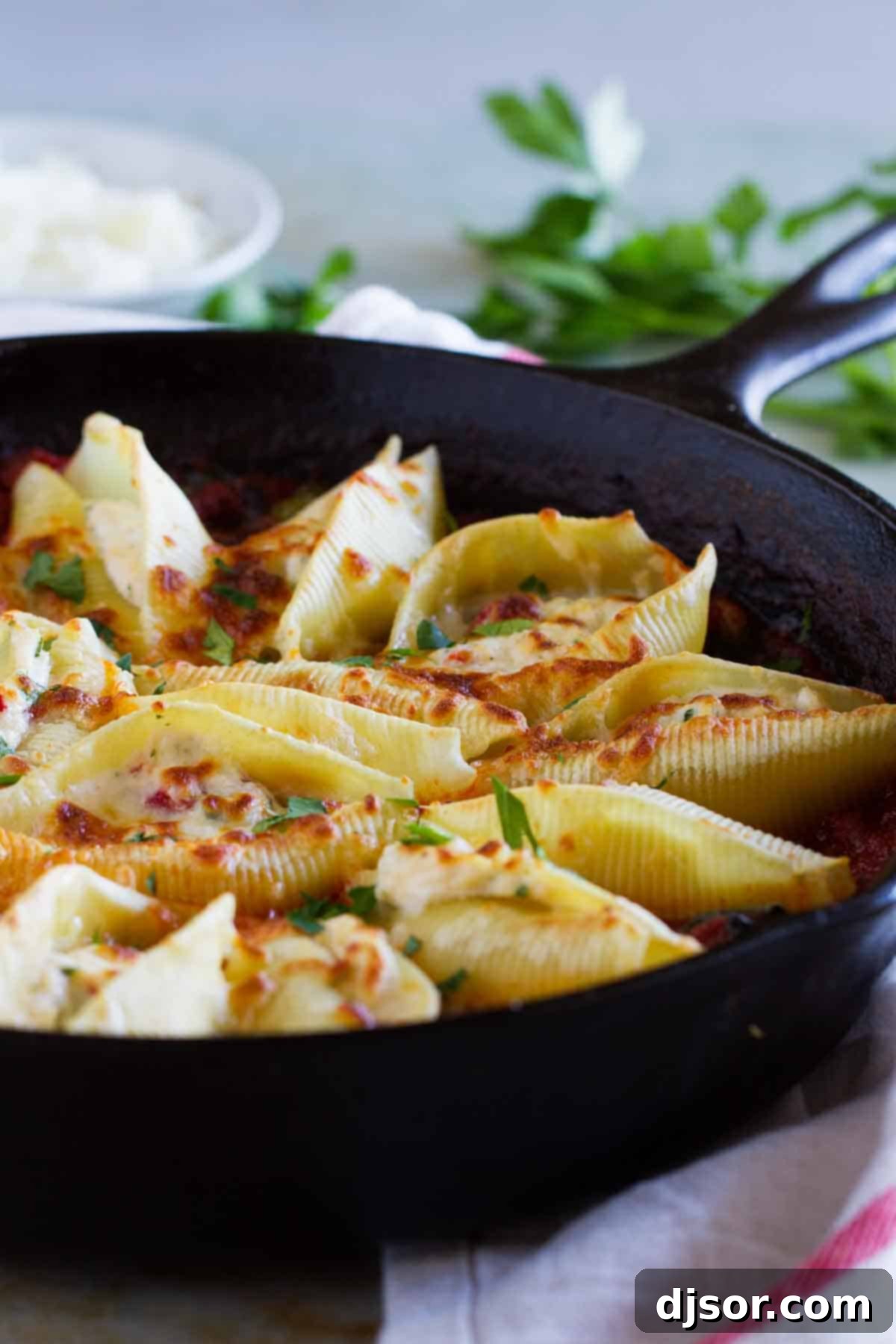 Stuffed Pasta Shells with Easy Bolognese Sauce in a cast iron skillet, ready to be served