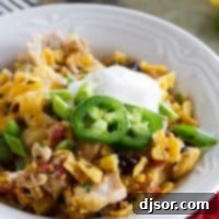 Slow Cooker Cheesy Chicken and Frito Casserole with vibrant colors.