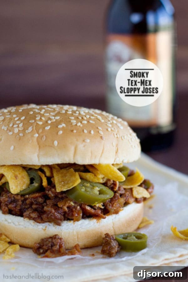 Smoky Tex-Mex Sloppy Joses served on buns with a side of chips. A spicy twist on classic sloppy joes.