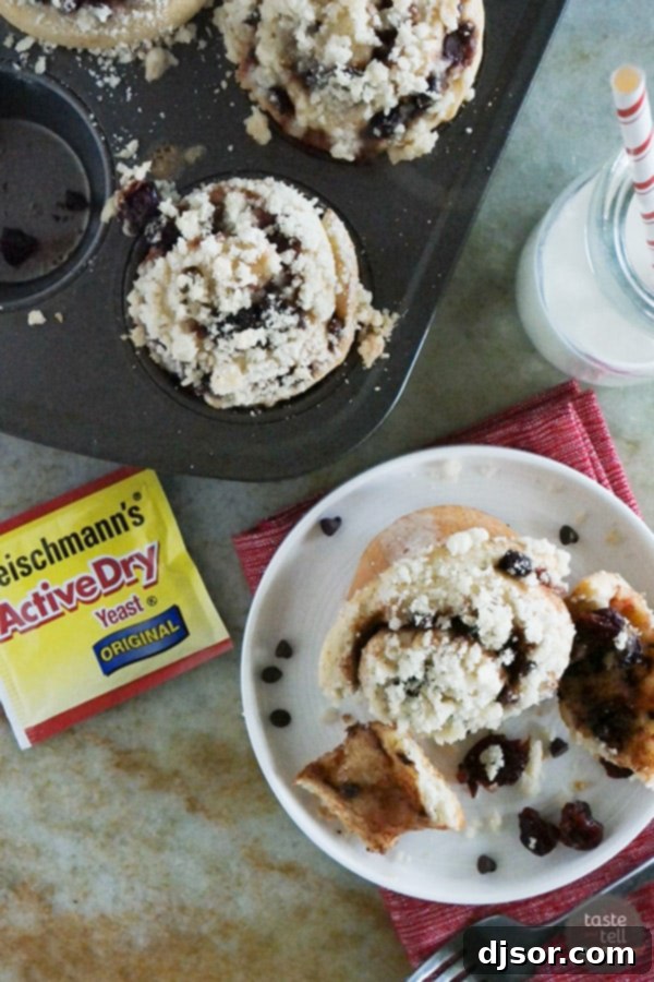Close-up of a plate of freshly baked Chocolate Cherry Streusel Rolls, ready to be served.