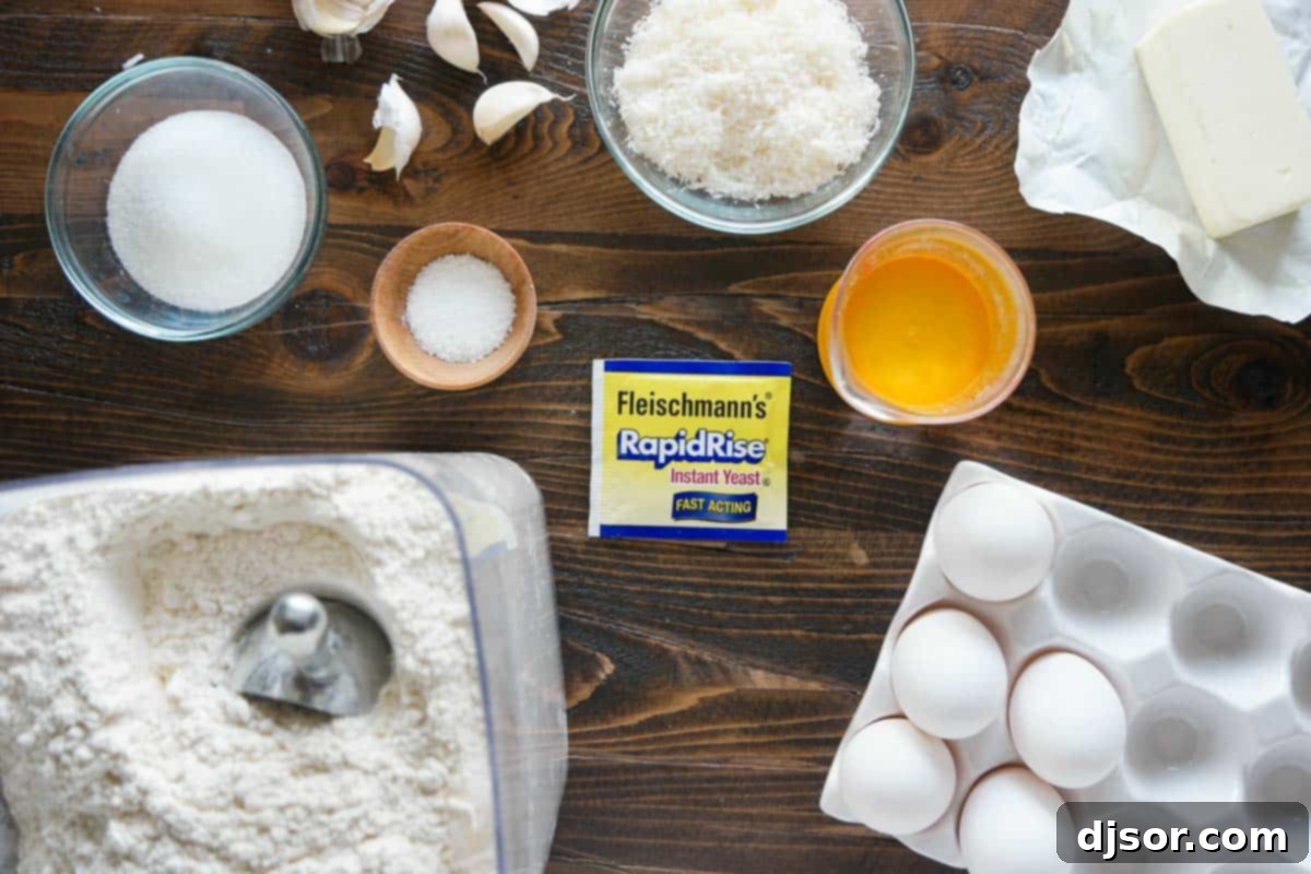 Fluffy Garlic Parmesan Brioche Buns 3 A selection of fresh ingredients laid out, ready for making Garlic Parmesan Brioche Buns, including flour, eggs, butter, garlic, and Parmesan cheese.