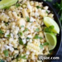 Fiesta Corn Salad 2 overhead view of grilled corn salad with cheese, cilantro and limes