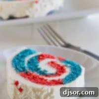 slice of 4th of July Cake Roll showing red and blue interior