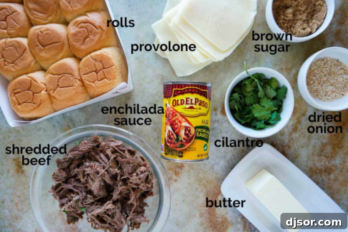 Ingredients laid out on a counter to make Enchilada Beef Sliders, including buns, beef, cheese, and sauces.