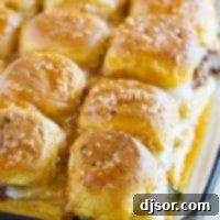 Enchilada Beef Sliders in a glass baking dish.