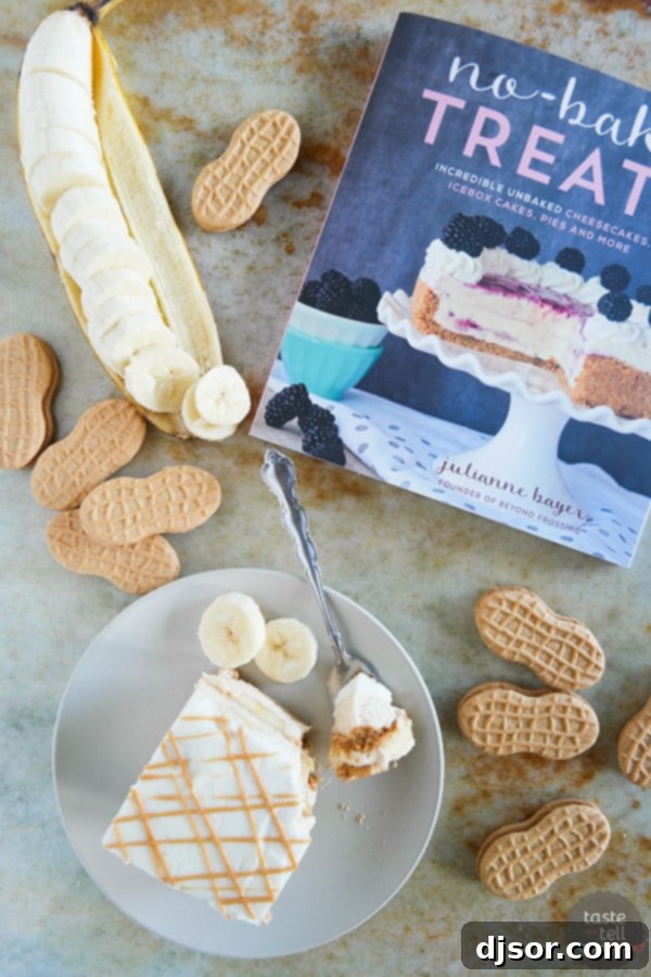 A stunning overhead view of the finished Peanut Butter Banana Icebox Cake, showcasing its beautifully layered structure, topped with whipped cream and a delicate peanut butter drizzle, ready to be served.