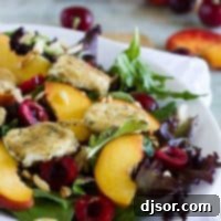 Crispy Chevre with Summer Stone Fruit 2 Salad topped with stone fruits and fried goat cheese.
