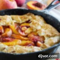 Cast Iron Peach Crostata with fresh peaches, ready to be served