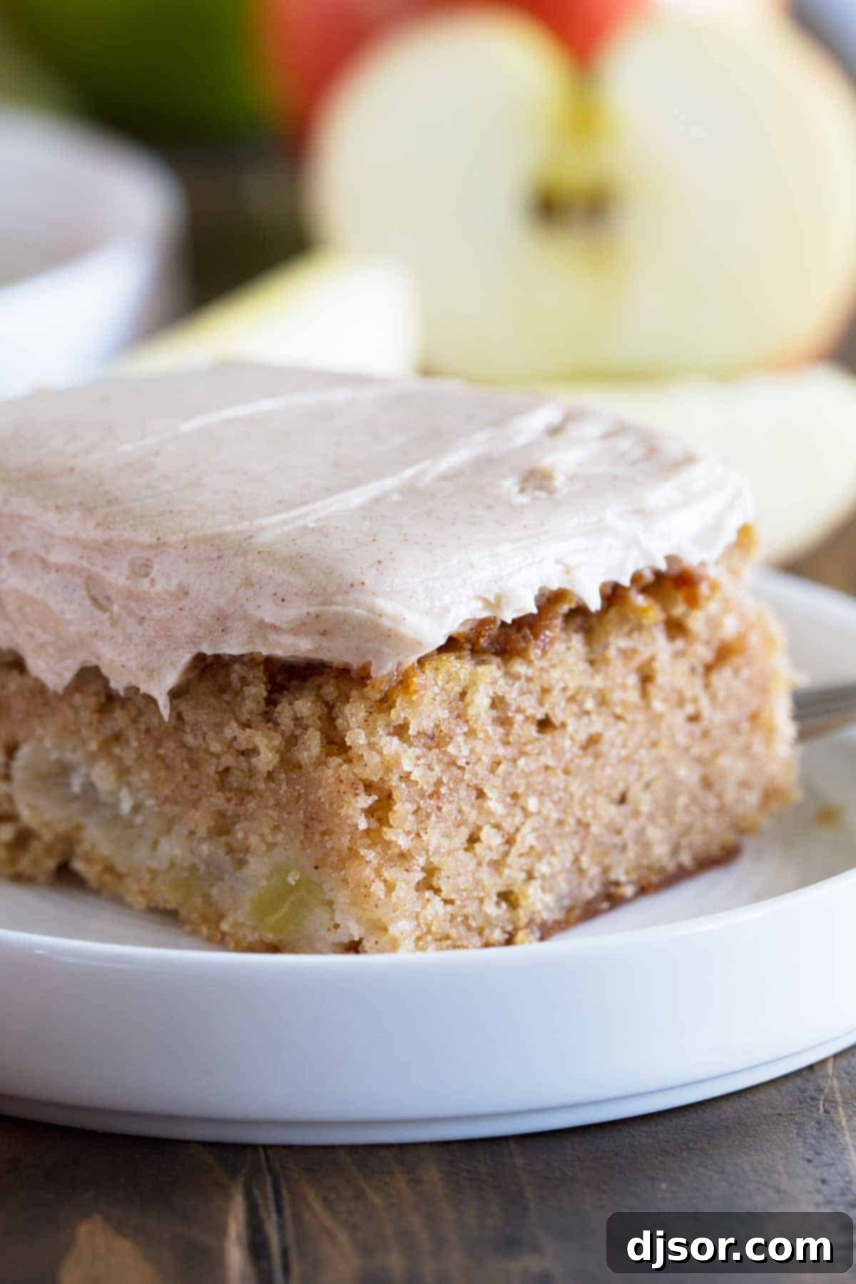 close up shot of slice of apple cinnamon sheet cake