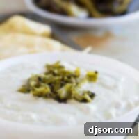 Velvety Hatch Green Chile Delight 2 bowl filled with creamy hatch green chile dip with chopped chiles on top