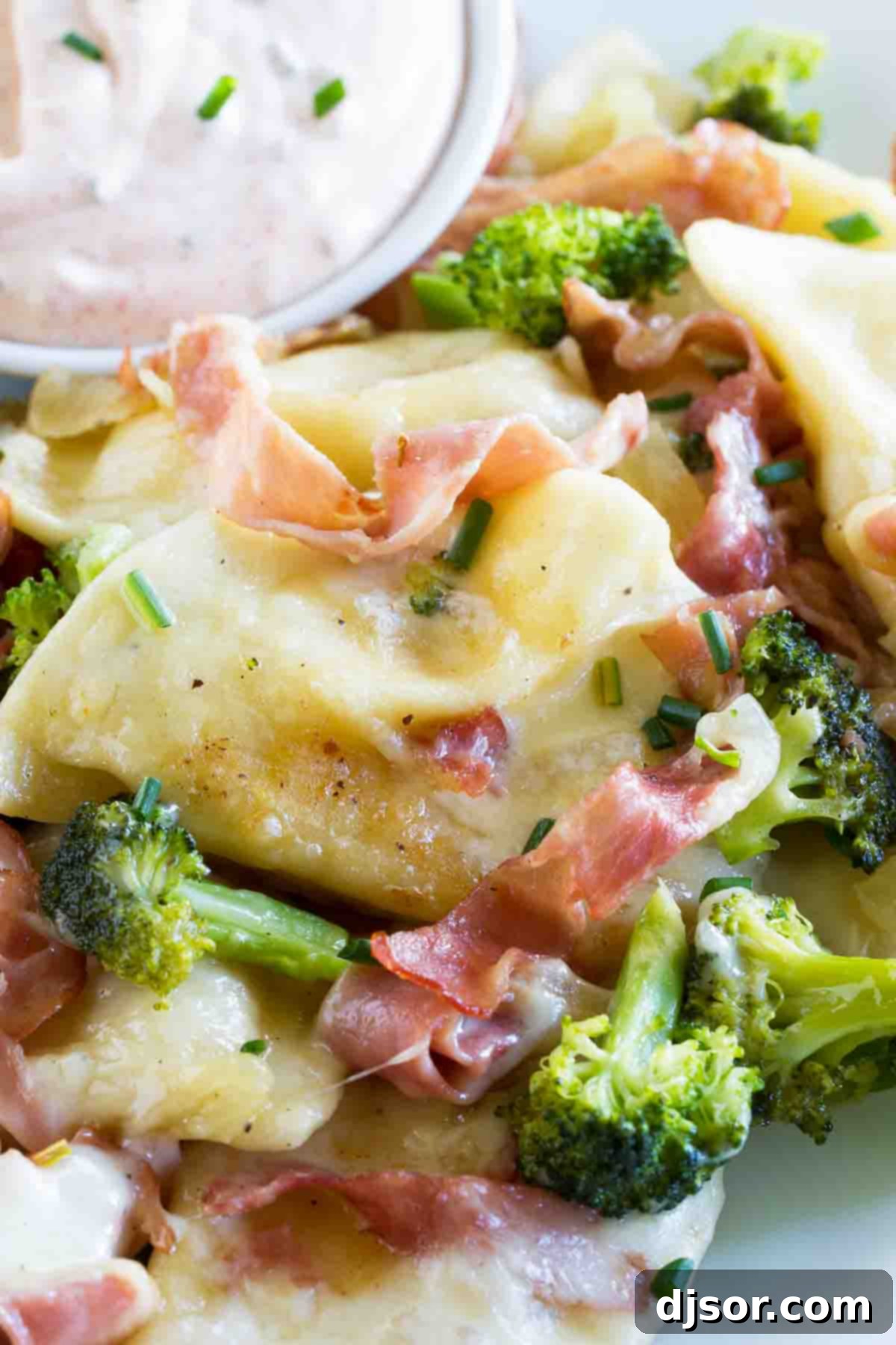 Simple ingredients for a quick and satisfying Pierogies with Ham and Broccoli dinner. A vibrant mix of frozen pierogi, diced ham, and fresh broccoli florets in a pan, ready for cooking.