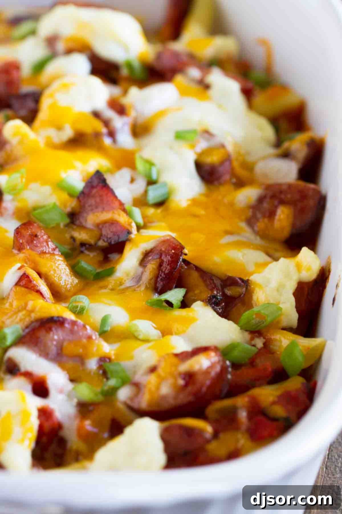 Baked Cheesy Kielbasa Pasta Casserole A baked casserole dish of golden brown Cheesy Kielbasa Pasta, fresh out of the oven.