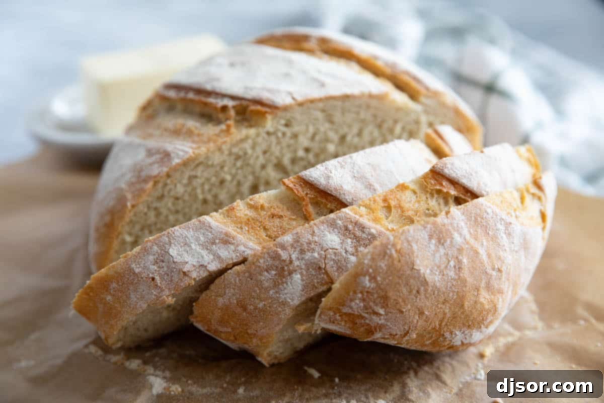 No Knead Crusty Artisan Bread 10 Loaf of artisan bread cut into slices.