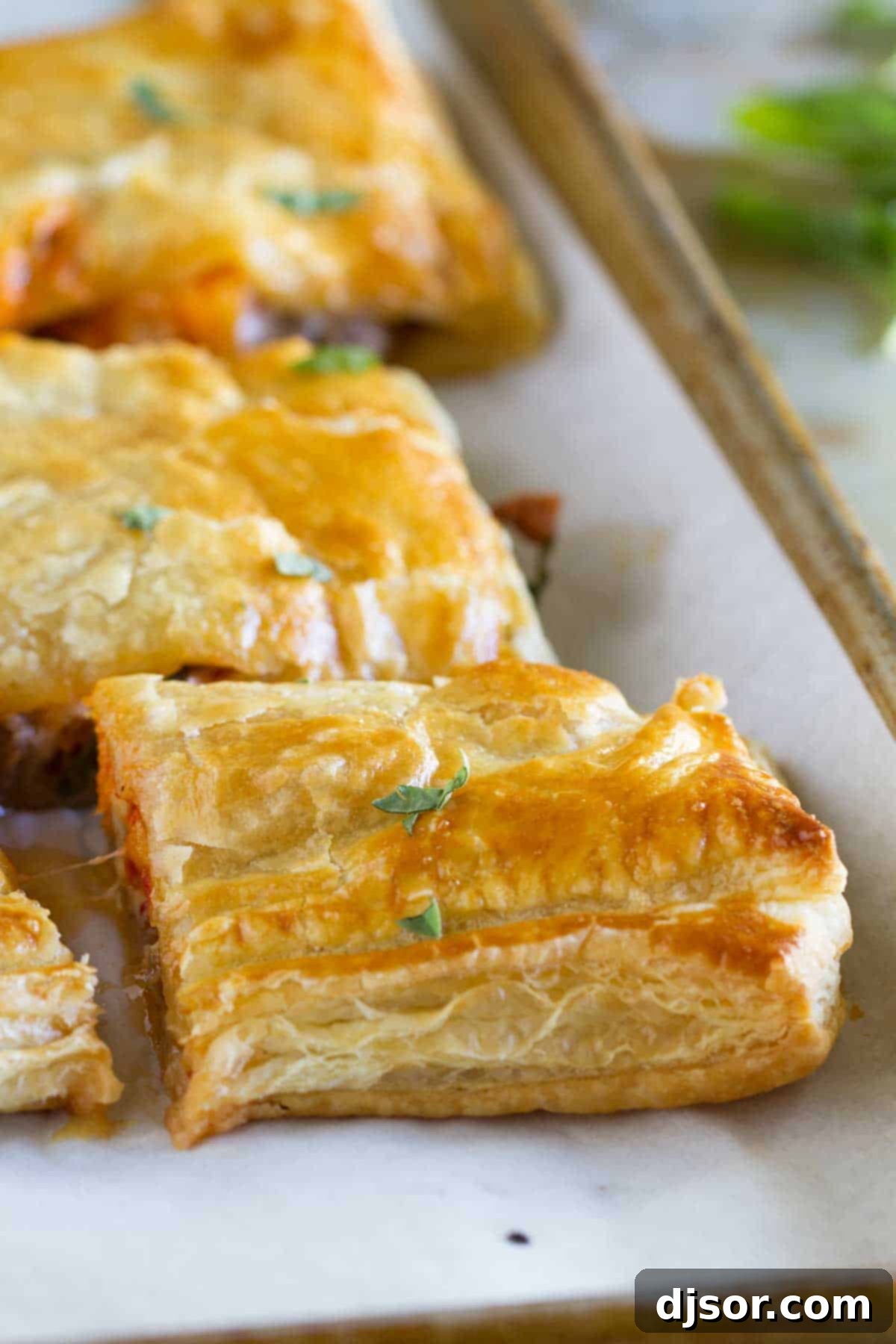 Sausage and Butternut Squash Slab Pie cut into perfect, mouth-watering slices, showcasing the rich filling.