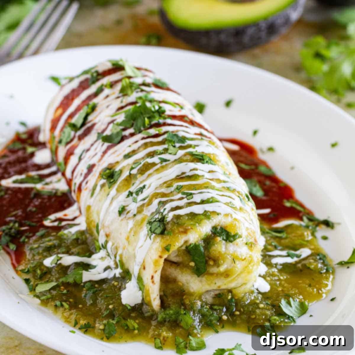 Covered in red, green and white (the Mexican flag colors), this Chicken Burrito Recipe brings the flavors of Mexico to your dining room table. Burrito Recipe with Chicken smothered with red and green sauces.