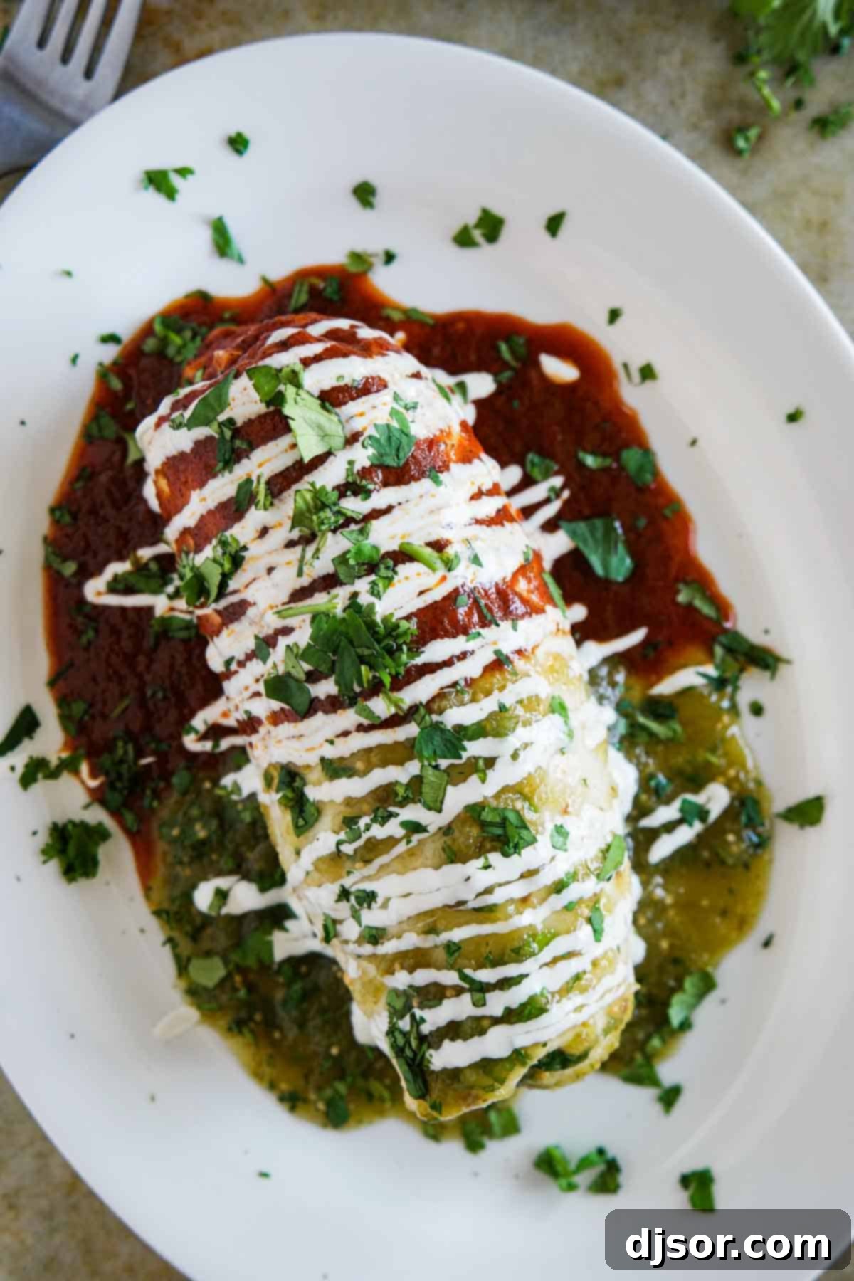 Covered in red, green and white (the Mexican flag colors), this Chicken Burrito Recipe brings the flavors of Mexico to your dining room table. Chicken Burritos Smothered with Red and Green Sauce