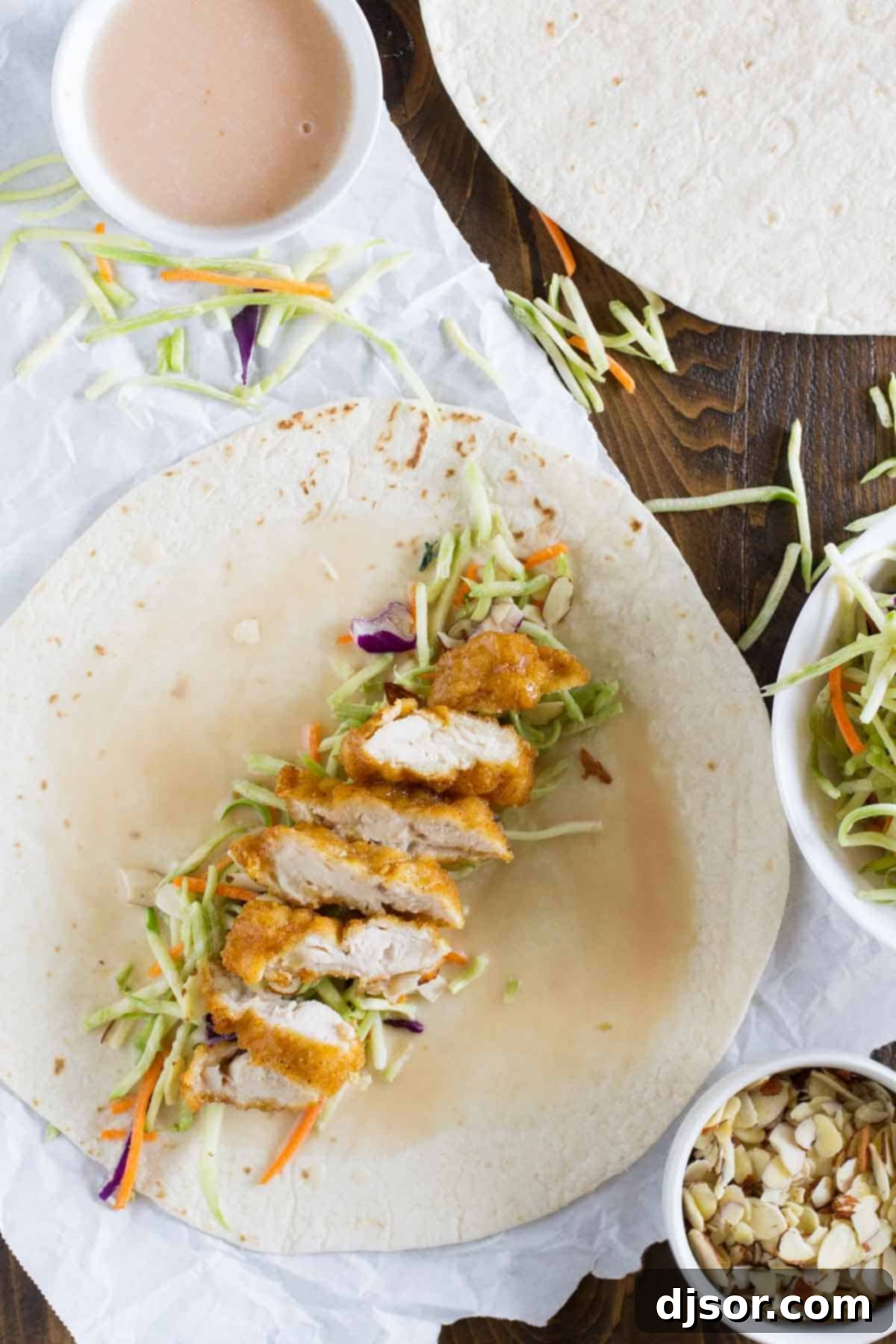 Sticky Honey Sesame Chicken Wraps 3 Easy honey sesame chicken salad wraps with homemade dressing, presented as a quick and healthy meal option.