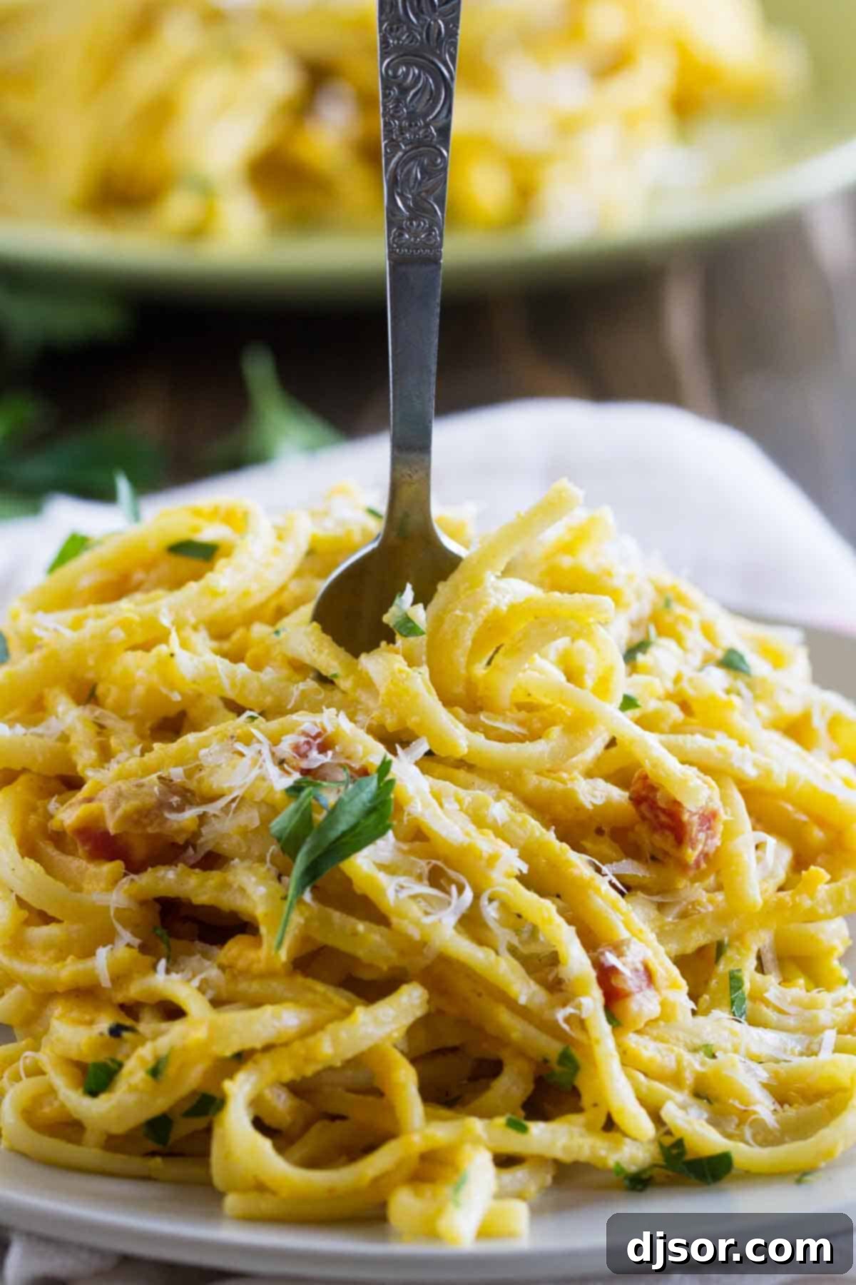 fork in pasta with butternut squash sauce