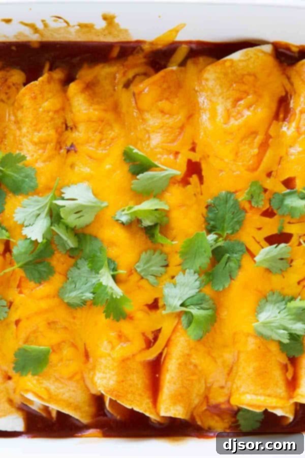 Thanksgiving Encore Enchiladas 5 Hands preparing Thanksgiving Leftover Enchiladas, showing turkey and stuffing mixture being rolled into a tortilla.