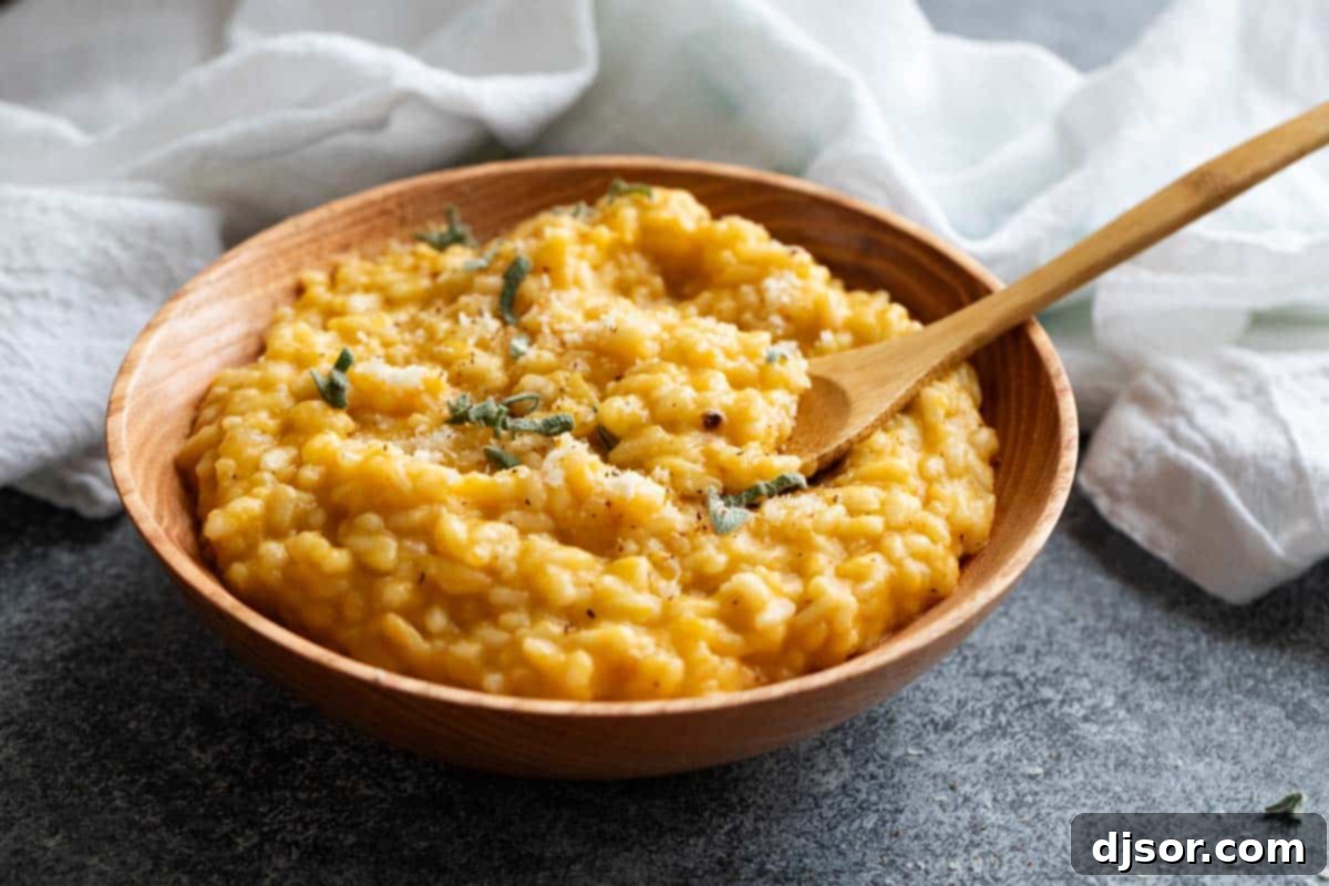 Golden Butternut Risotto 2 A beautifully presented bowl filled with creamy butternut squash risotto, garnished with fresh herbs.