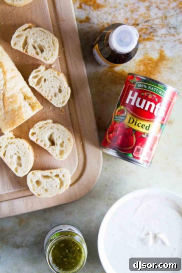 Vibrant Feta, Pesto, and Tomato Bruschetta 3 A close-up shot of Feta Pesto Tomato Bruschetta, highlighting the vibrant colors and creamy whipped feta base.