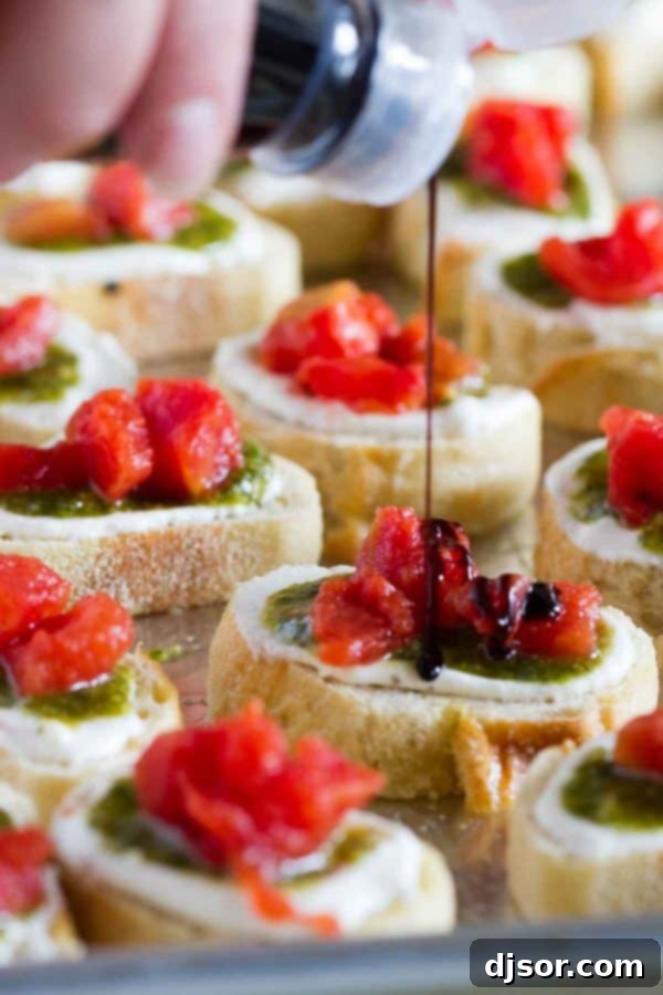 Vibrant Feta, Pesto, and Tomato Bruschetta 5 Close-up of Feta Pesto Tomato Bruschetta showing the texture of the whipped feta and diced tomatoes.