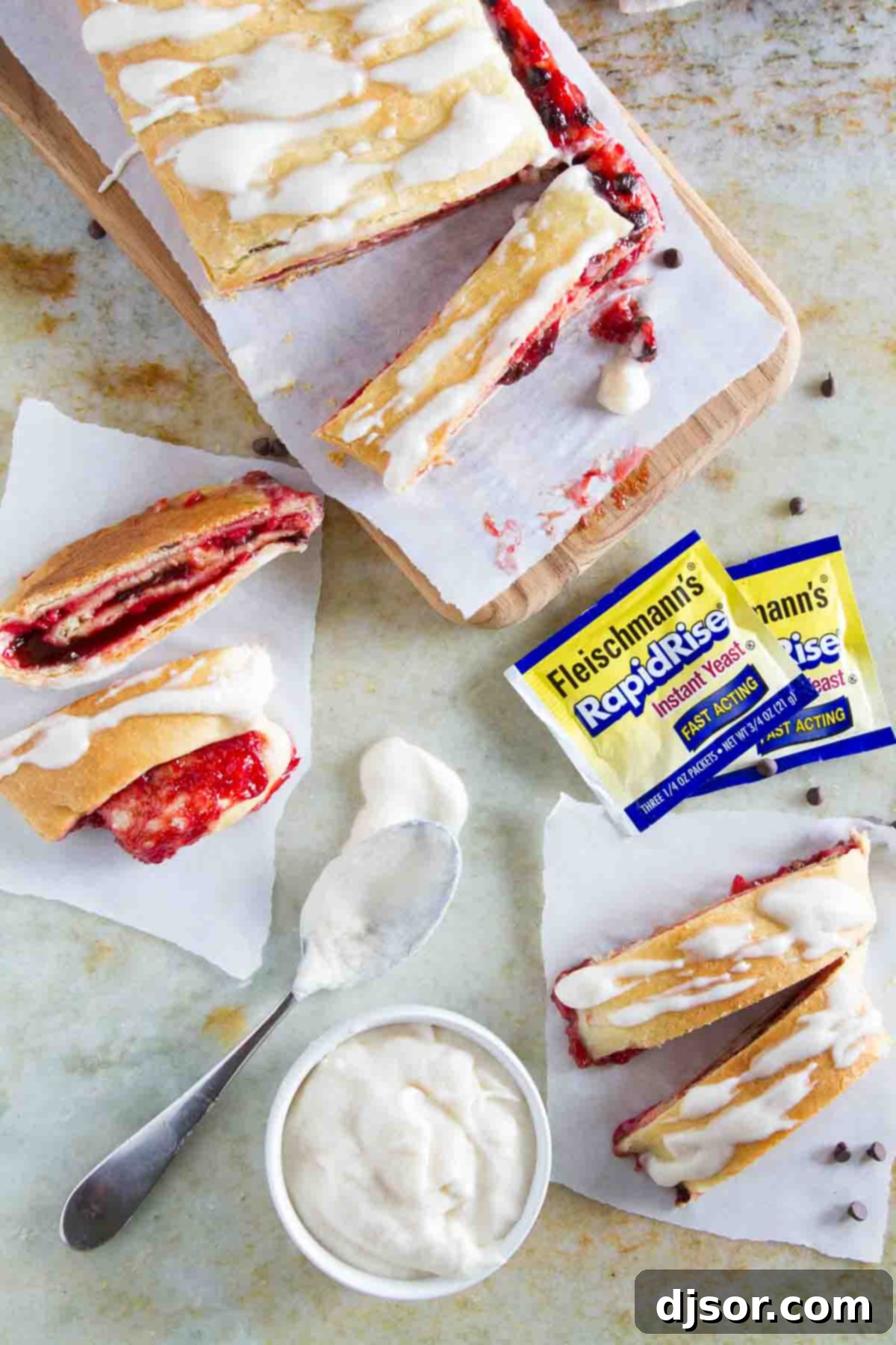 Several slices of Chocolate Cherry Roll arranged on a white plate, revealing the swirls of cherry and chocolate inside the soft dough, ready to be served.