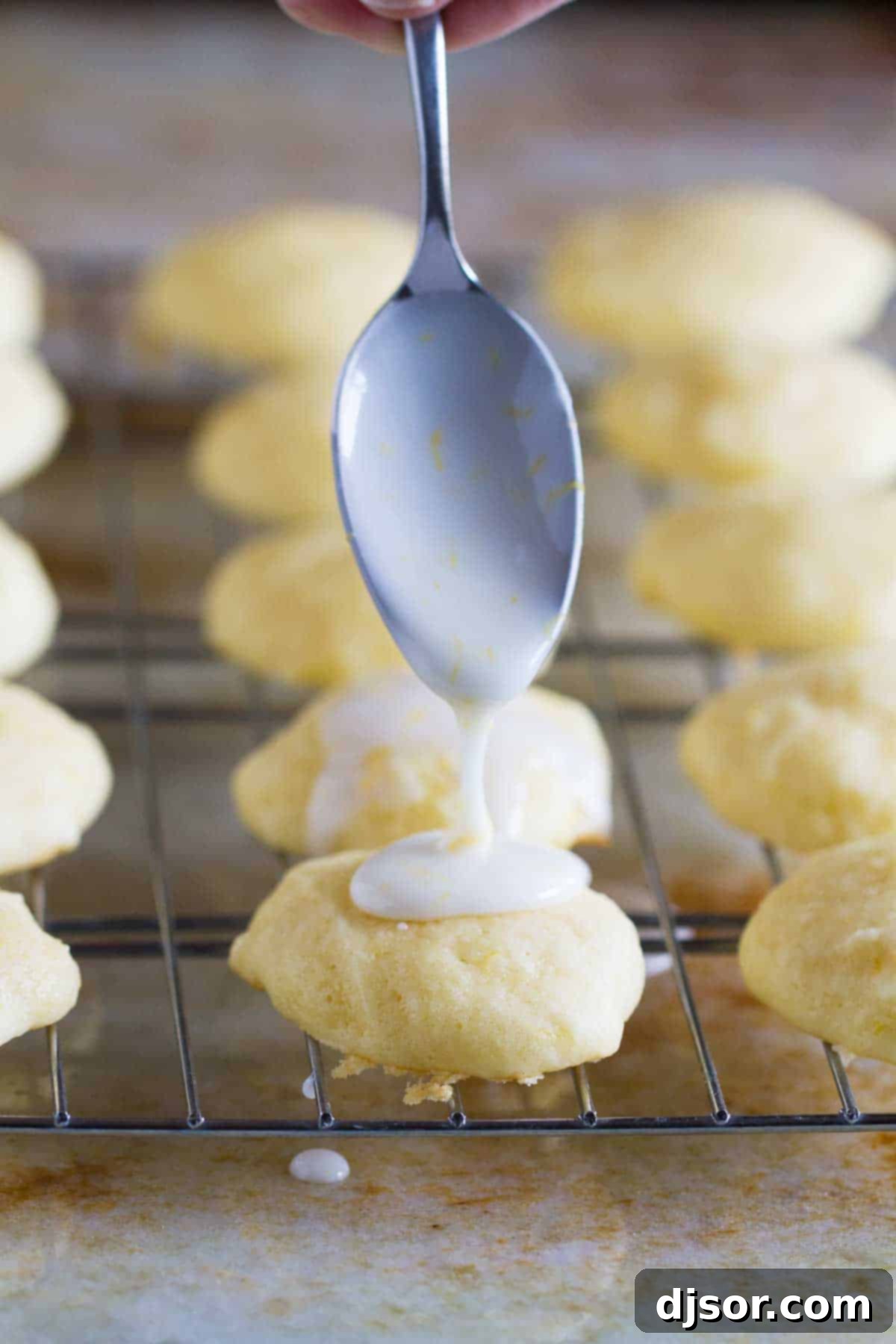 drizzling glaze on ricotta cookies