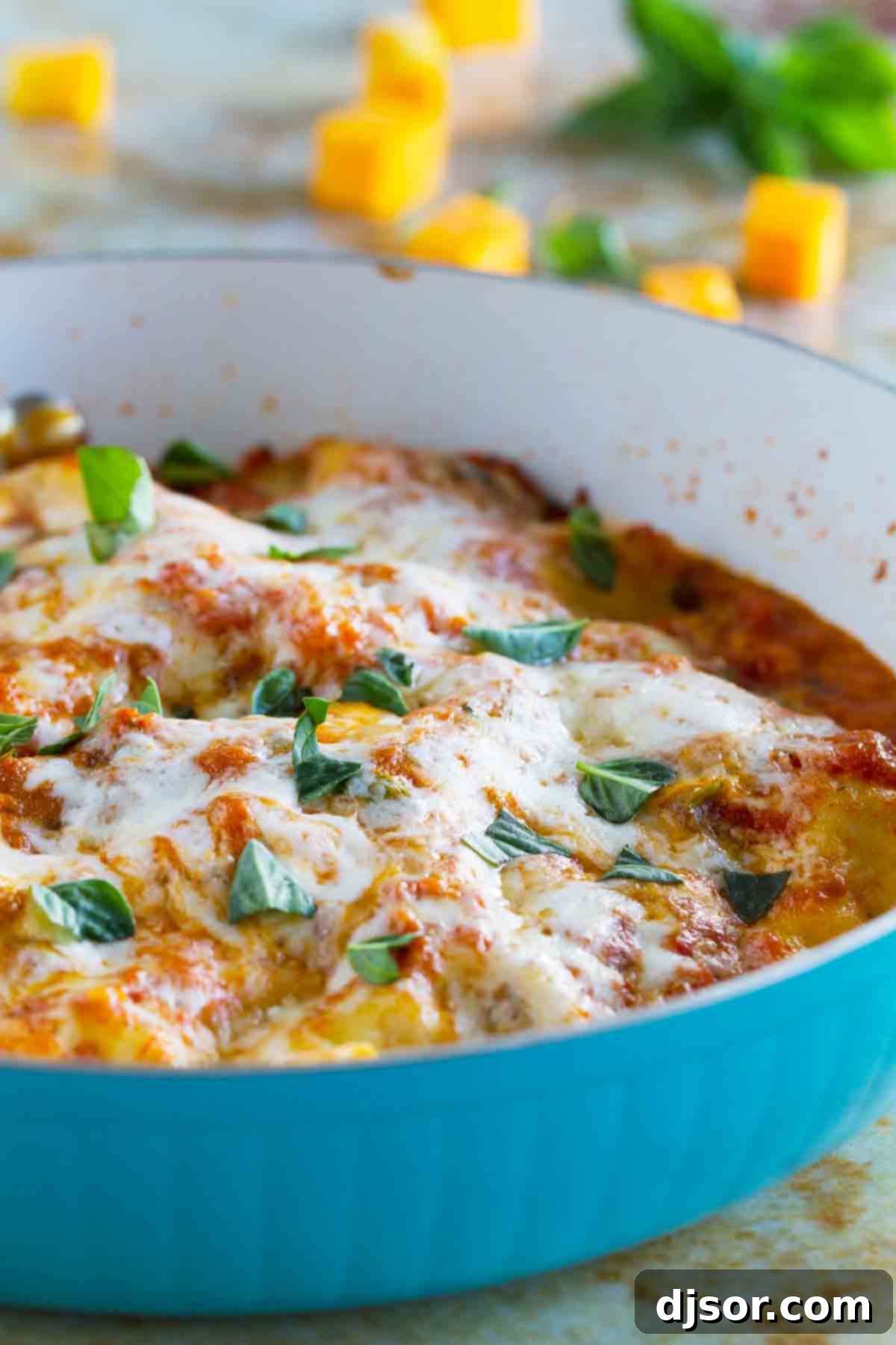 Skillet Butternut Squash Lasagna: Effortless, Delicious, One-Pan Vegetarian Comfort Food A vibrant blue skillet filled with golden butternut squash lasagna, ready to be served, capturing the essence of a hearty vegetarian meal.